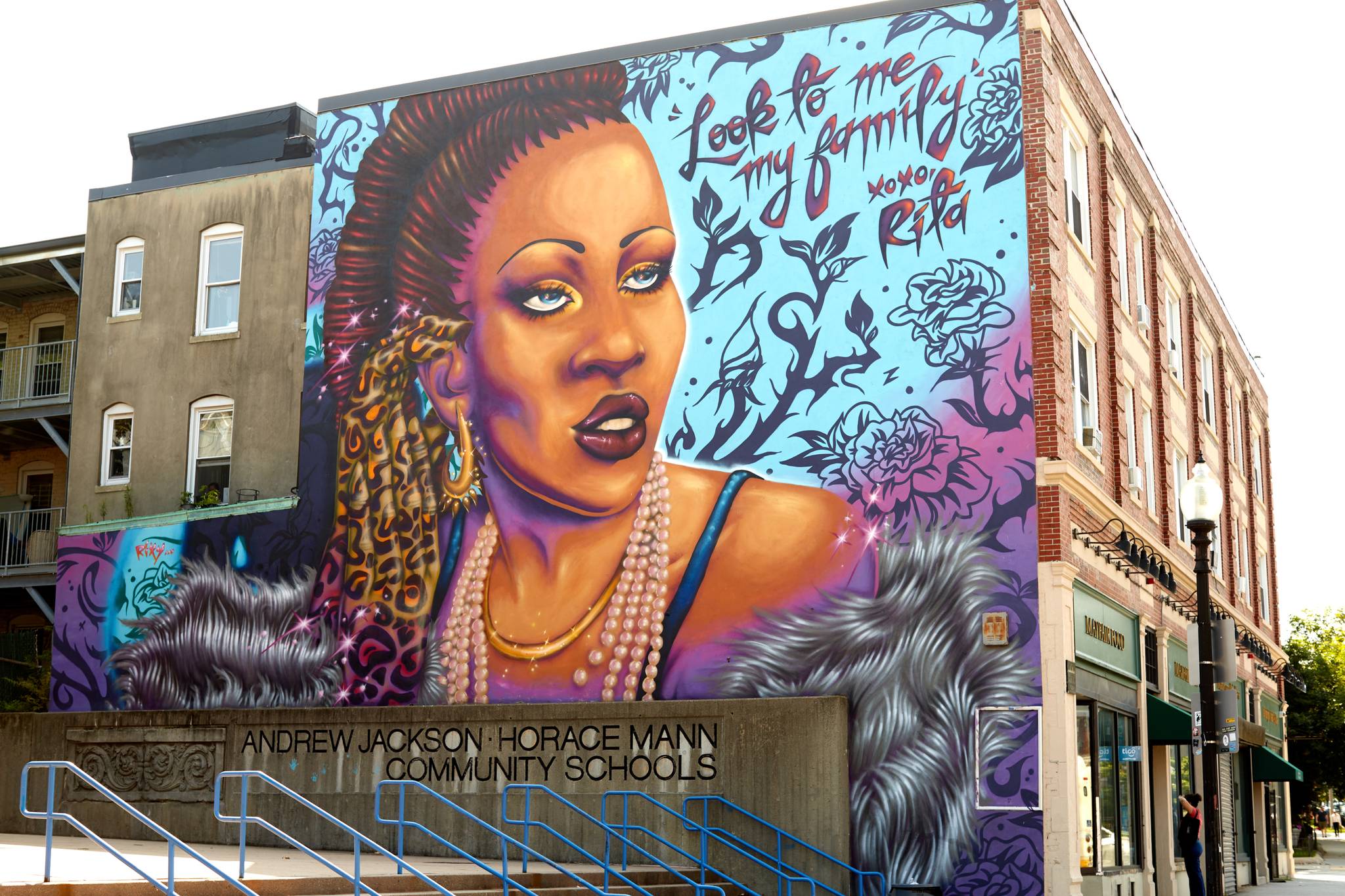 A mural depicting Rita Hestor with the words "Look to me, my family. xoxo Rita"